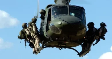 Special Operations Forces prepare to disembark from a Griffon helicopter.